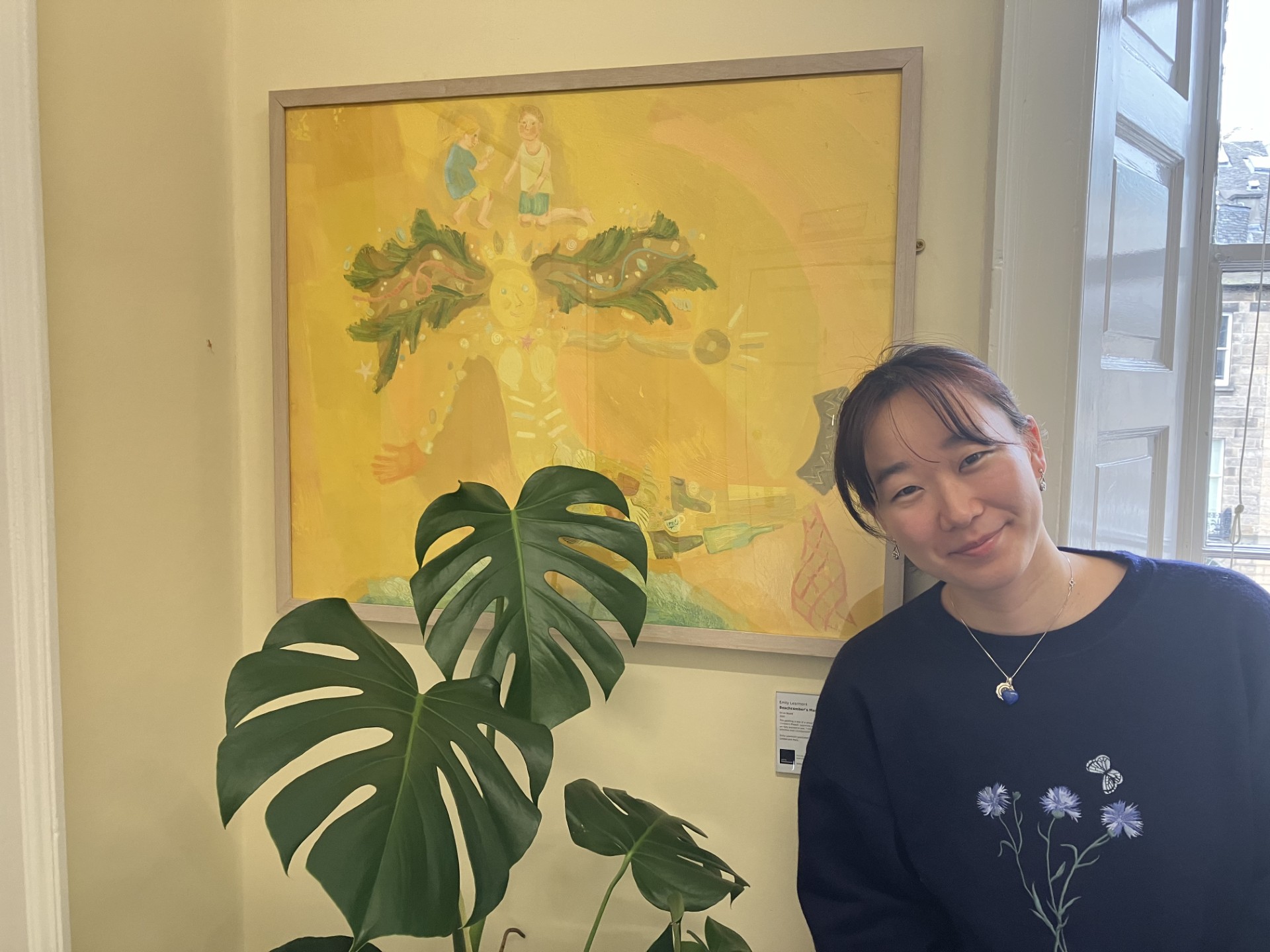 Marino in the Parenting across Scotland office next to Umburto the plant